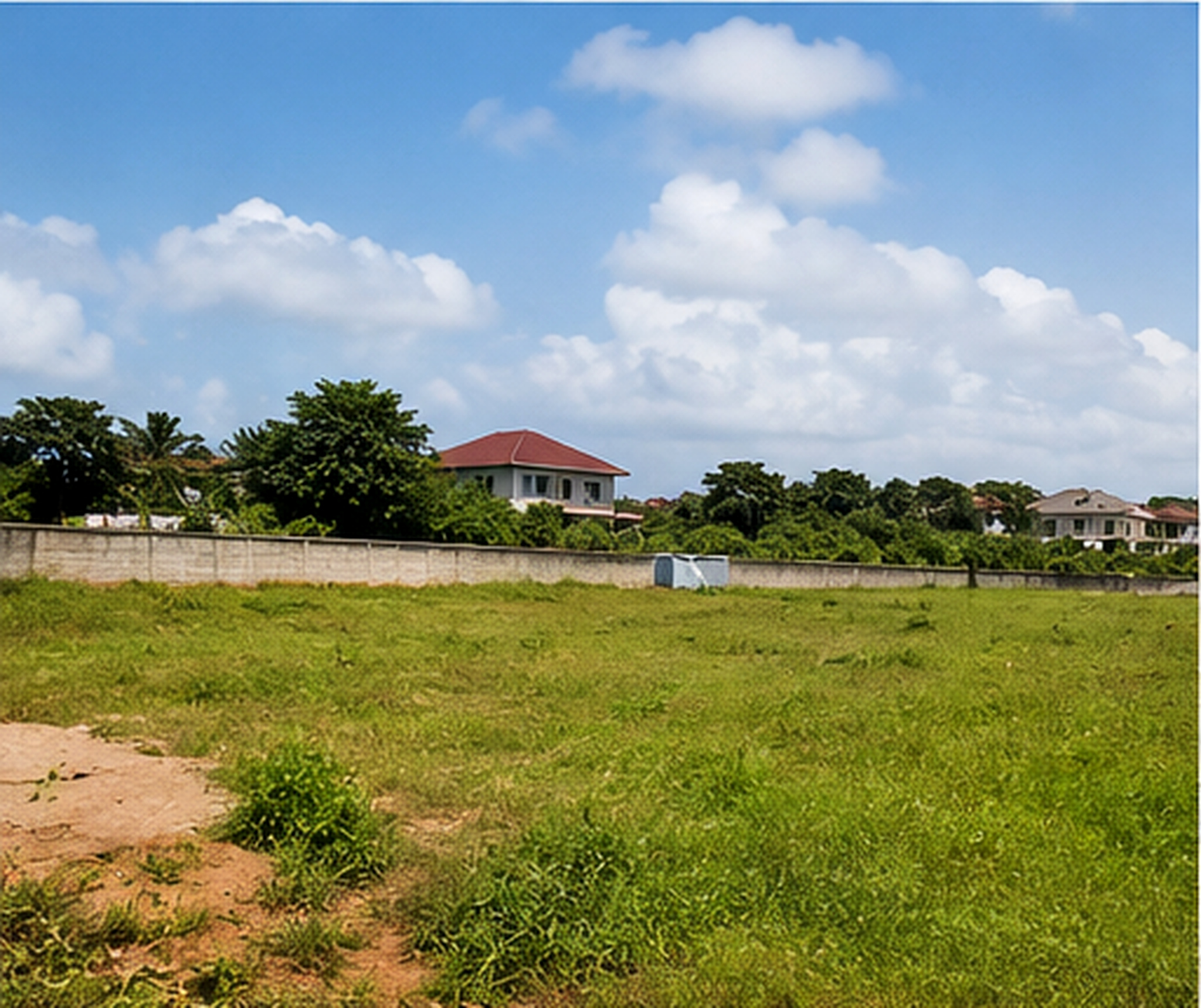 Open land parcel with boundary walling